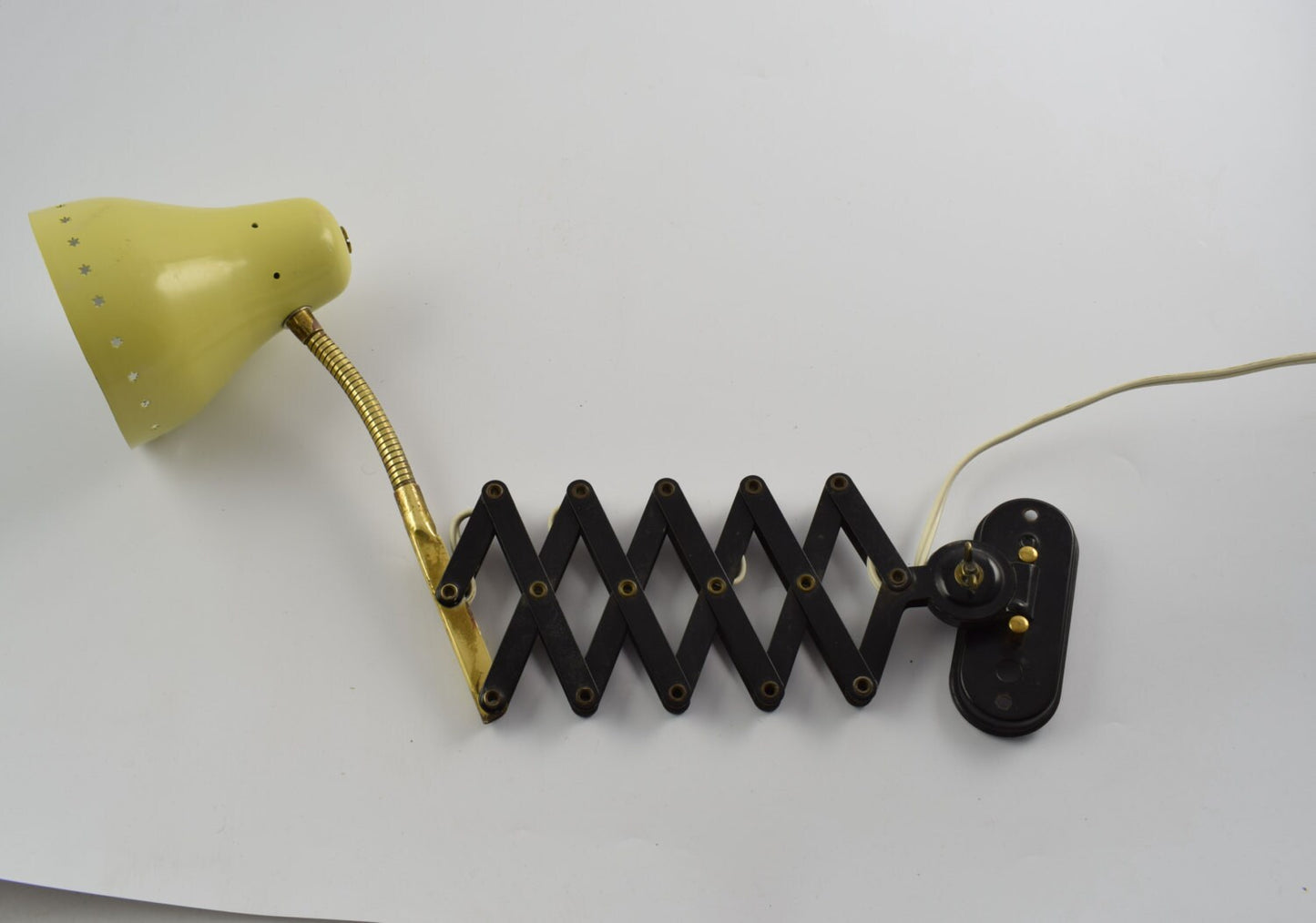 Old yellow scissors wall lamp from the 60s attributed to dutch company Hala