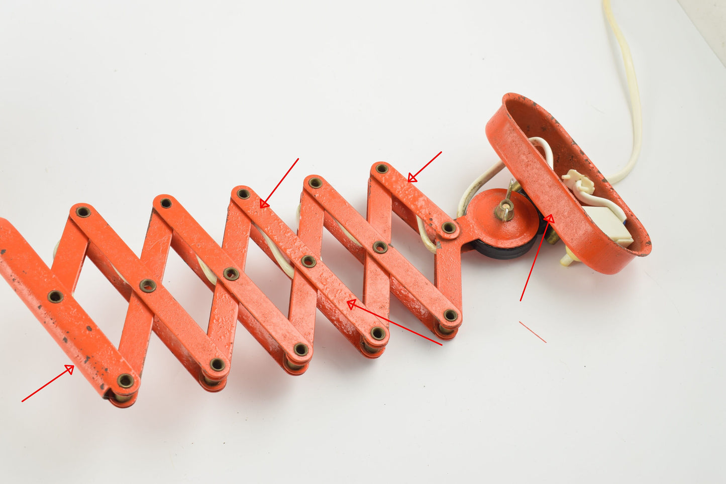 Red scissors wall lamp from the 60s harmonica wall light from dutch company Hala