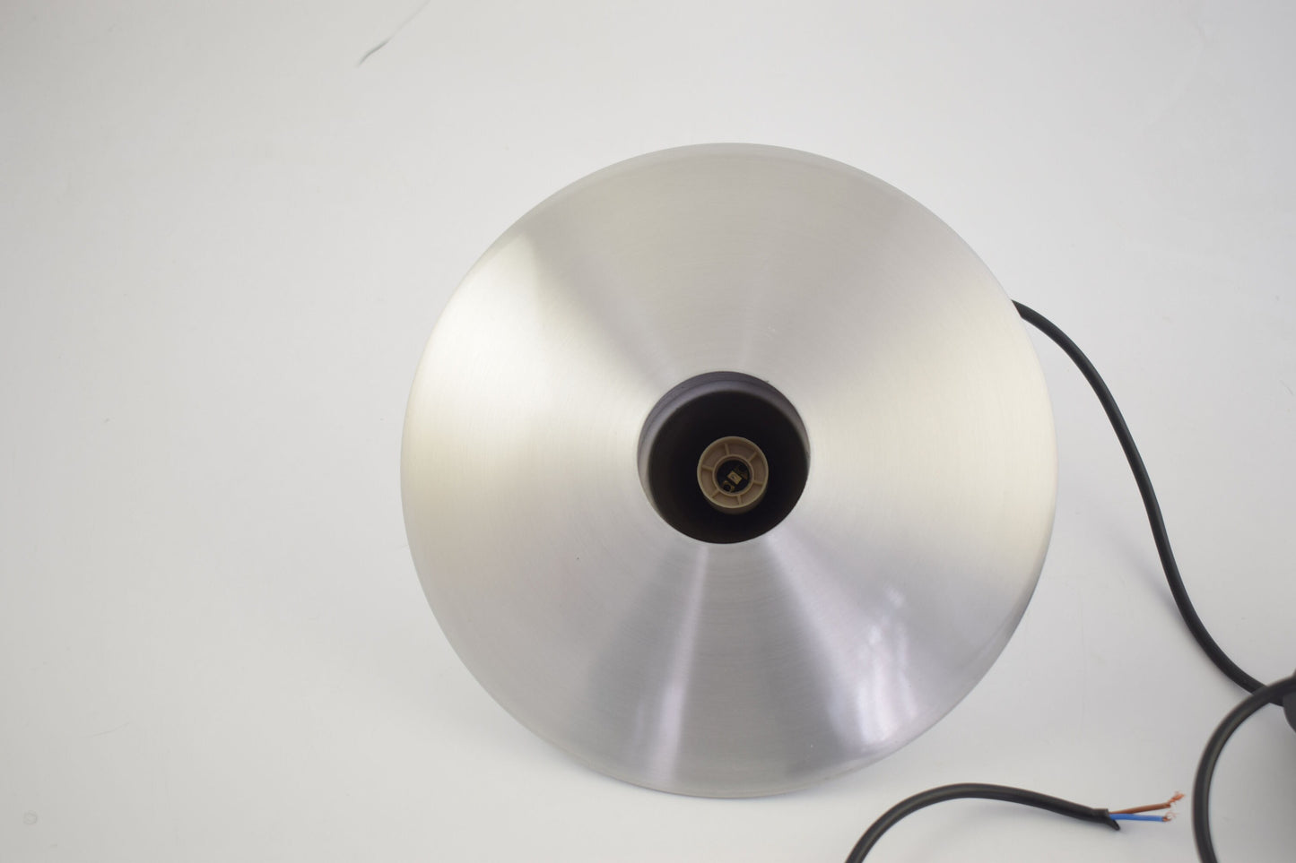 Aluminum hanging lamp in the shape of an ufo from dutch design company Hala.