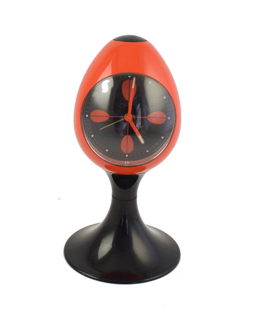 Red alarm clock, black pedestal tulip shape, made in Germany. Space age era, made of plastic from the early 1970s