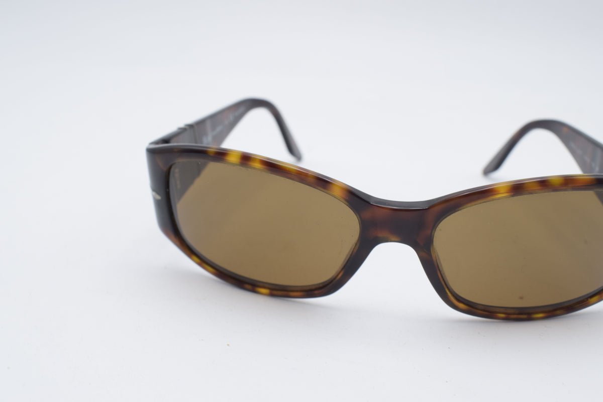 Persol 2756 s Tortoiseshell sunglasses with brown tinted lenses, photographed on a plain white background.