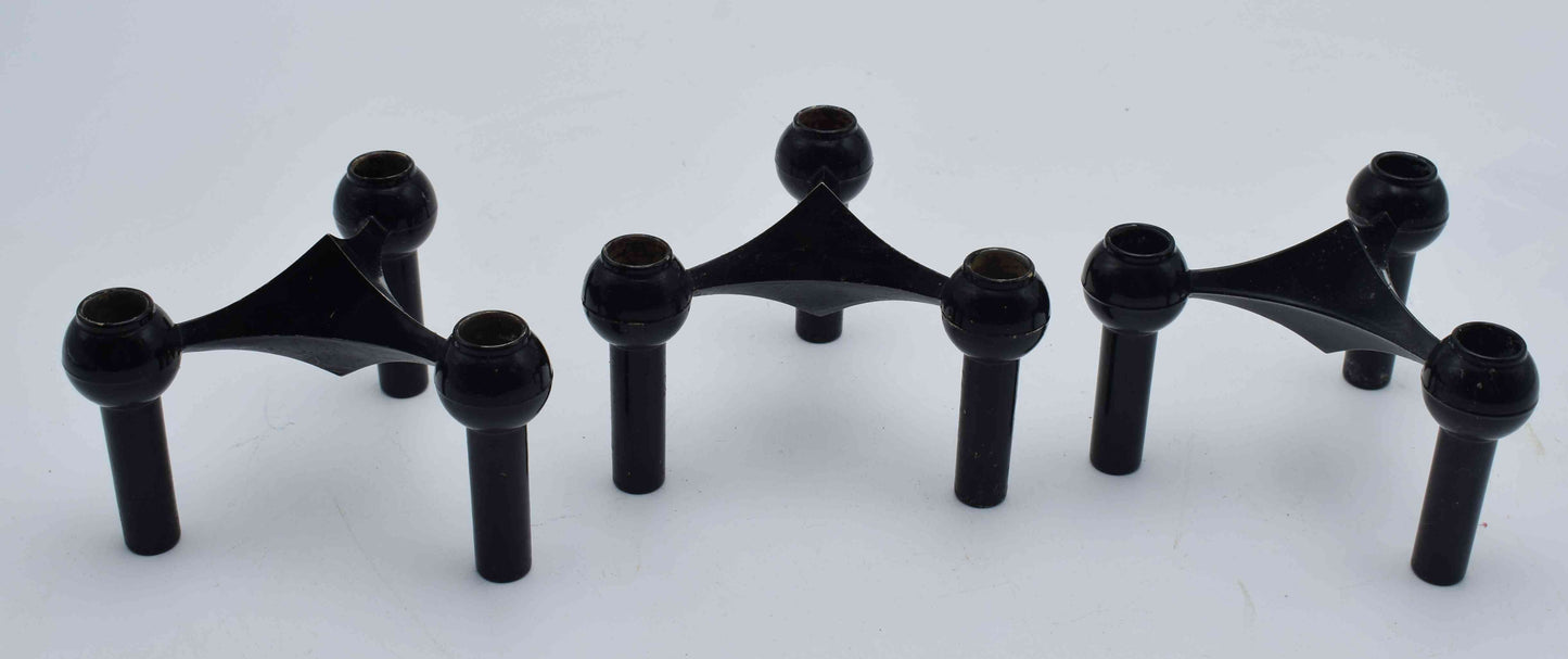 Set of black metal brackets on a white background