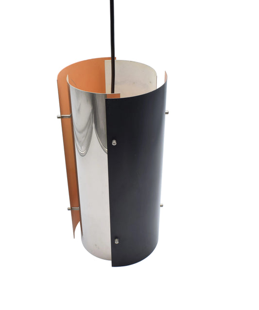 1970s Scandinavian pendant lamp with two black and two chrome quarter‑cylinder plates, chrome rods, and warm orange inner lacquer creating a directional glow