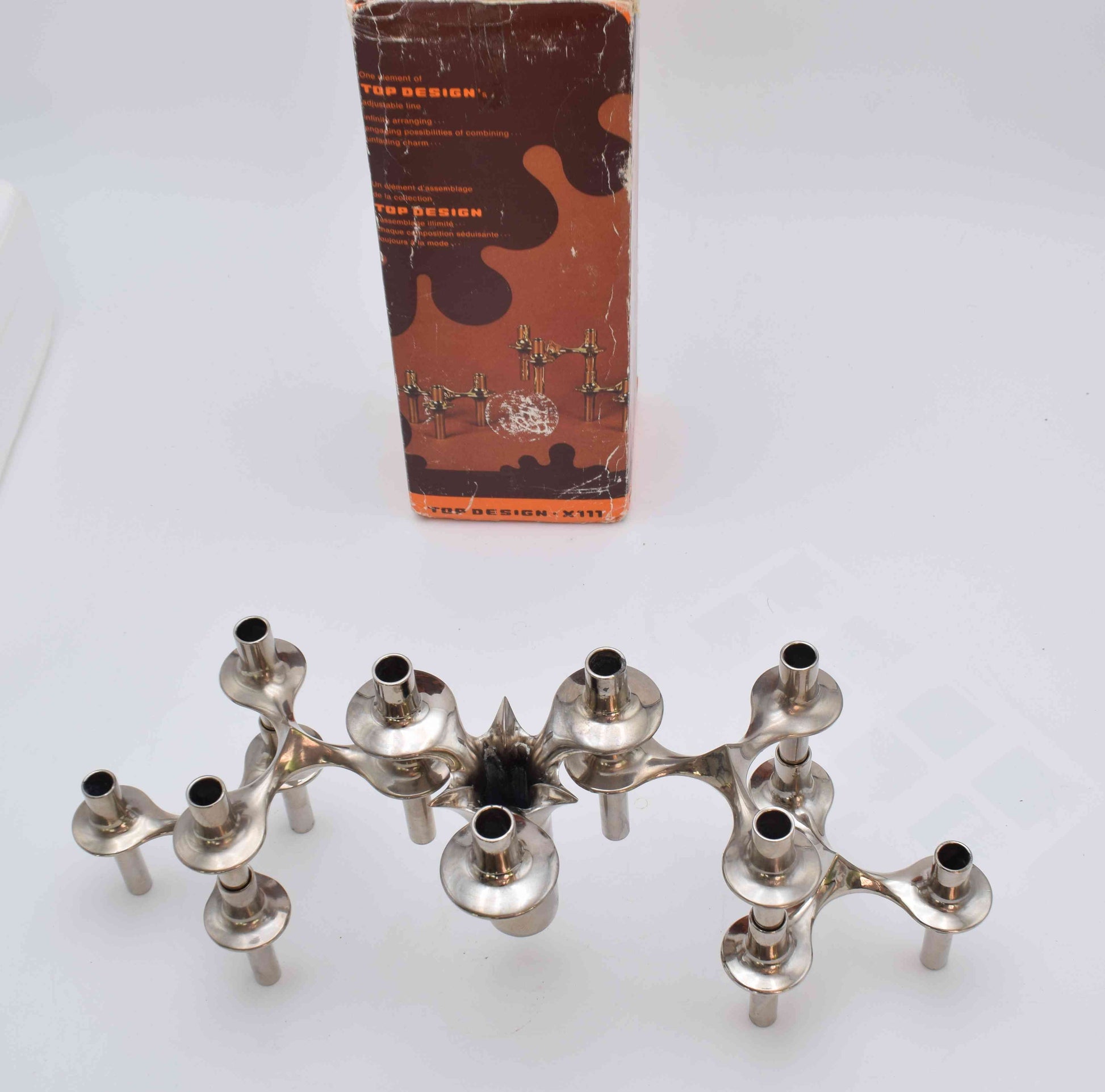 candle holders, nagel, eames era, candles, candle sticks, space age, mid century, midcentury modern, BMF, mad men, chrome home decor, MICHAEL ARAM, AERIN lauder