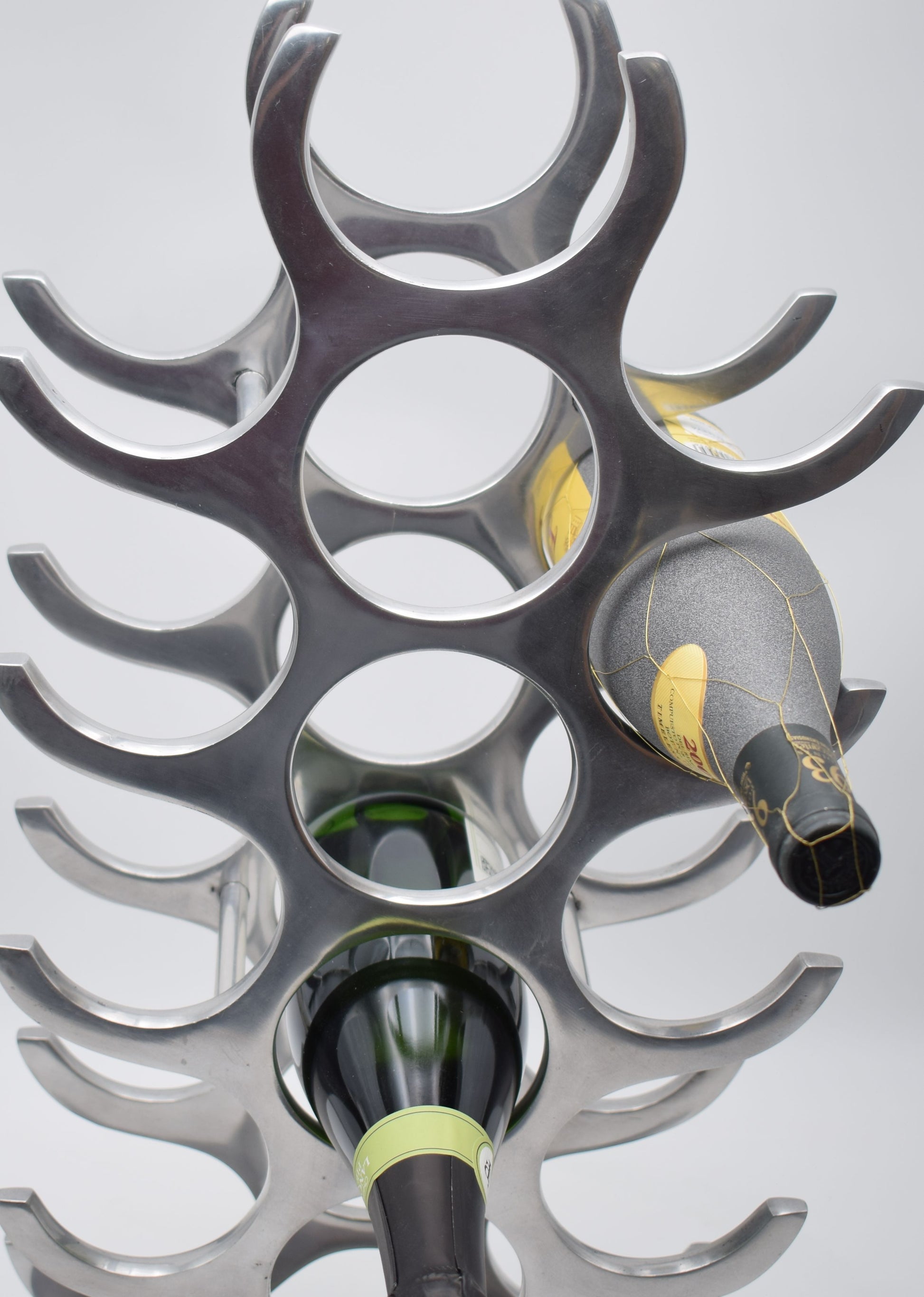 wine rack metal, michael noll, German design, Barolo italy, kitchen design, Château Margaux, Opus One, Marqués de Riscal, modernist decor, bottle holder, industrial interior, wine bottle stand, kitchen storage