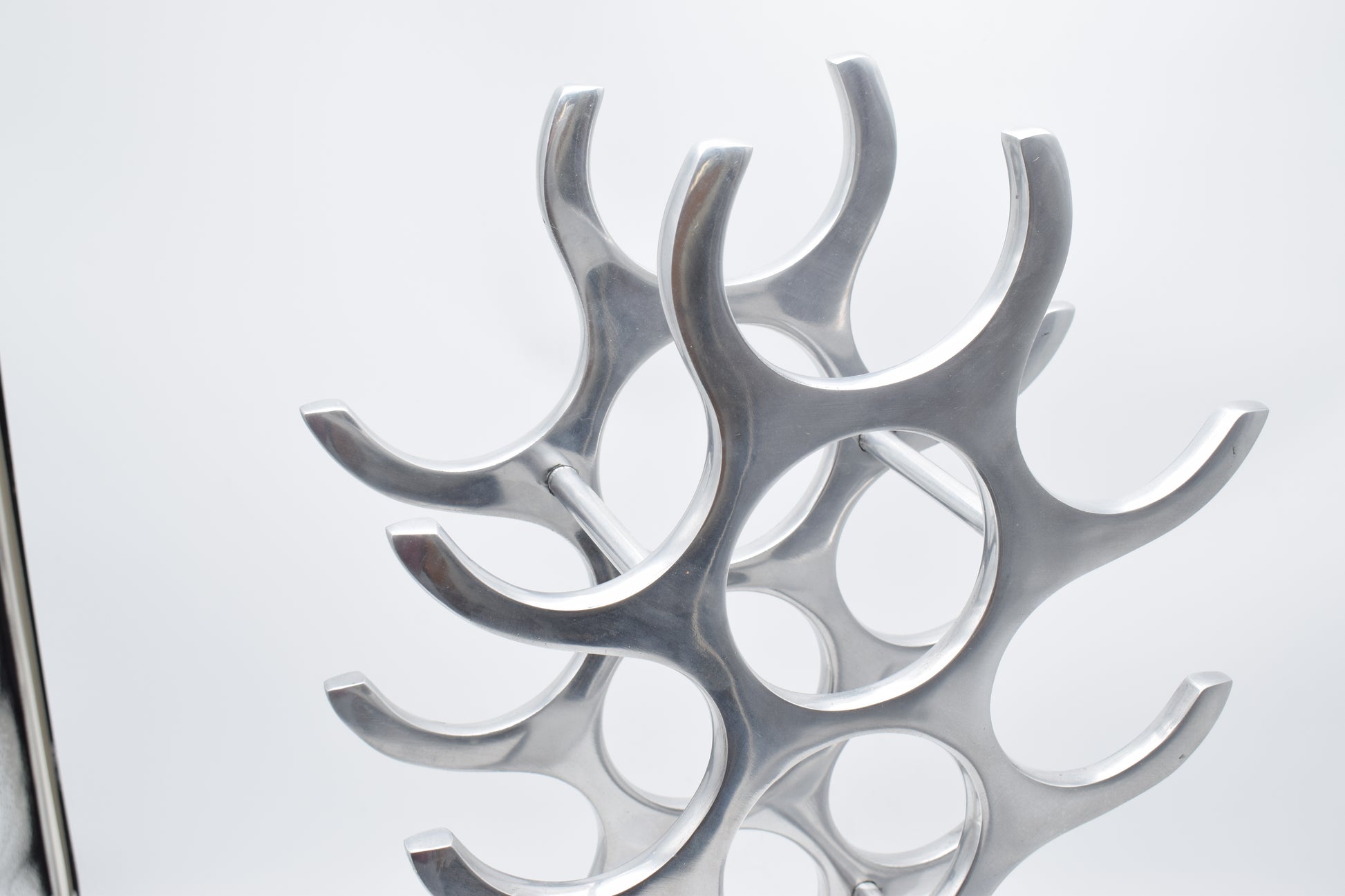 wine rack metal, michael noll, German design, Barolo italy, kitchen design, Château Margaux, Opus One, Marqués de Riscal, modernist decor, bottle holder, industrial interior, wine bottle stand, kitchen storage