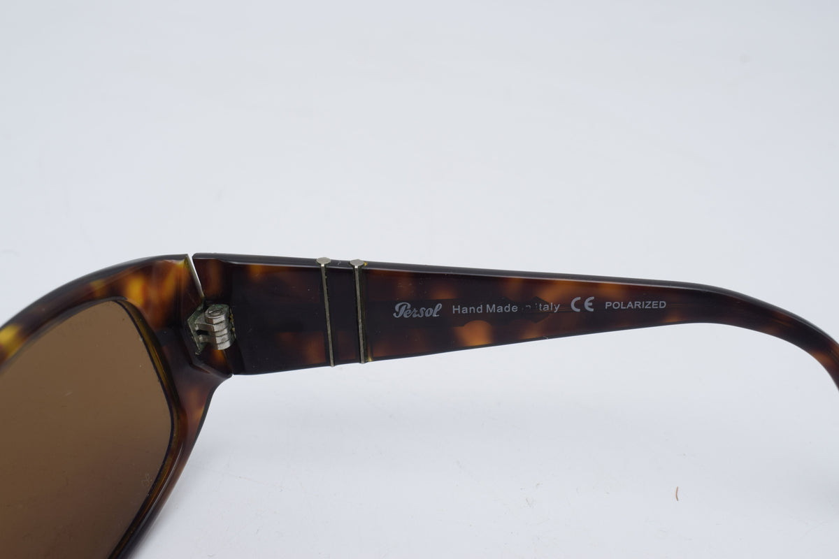 Persol 2756 s Tortoiseshell sunglasses with brown tinted lenses, photographed on a plain white background.