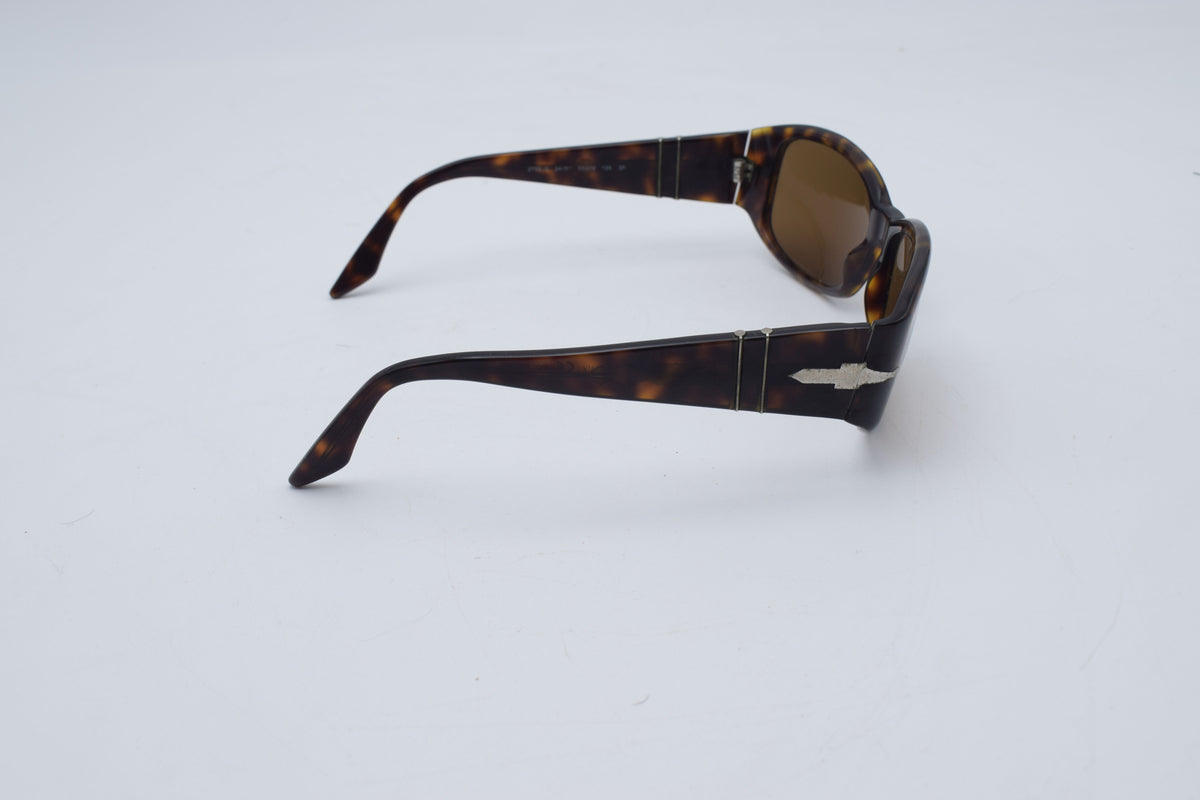 Persol 2756 s Tortoiseshell sunglasses with brown tinted lenses, photographed on a plain white background.