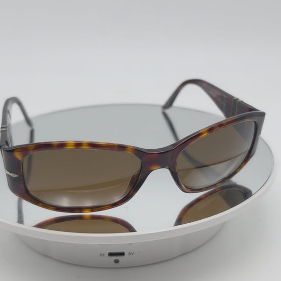 Persol 2756 s Tortoiseshell sunglasses with brown tinted lenses, photographed on a plain white background.