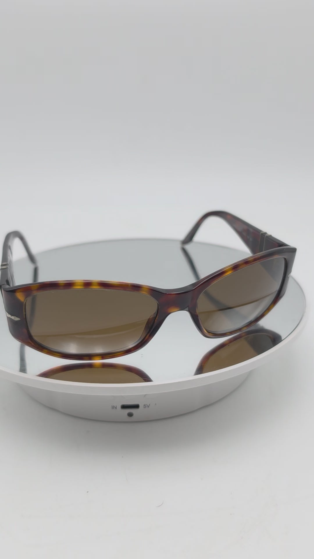 Persol 2756 s Tortoiseshell sunglasses with brown tinted lenses, photographed on a plain white background.