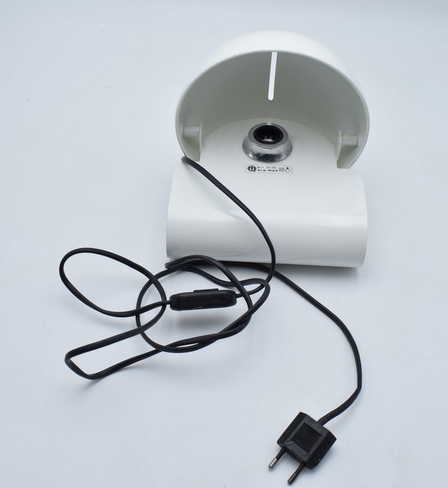 Detail photo of the Bugia lamp’s hinge and painted metal surface, showing minor vintage wear consistent with age