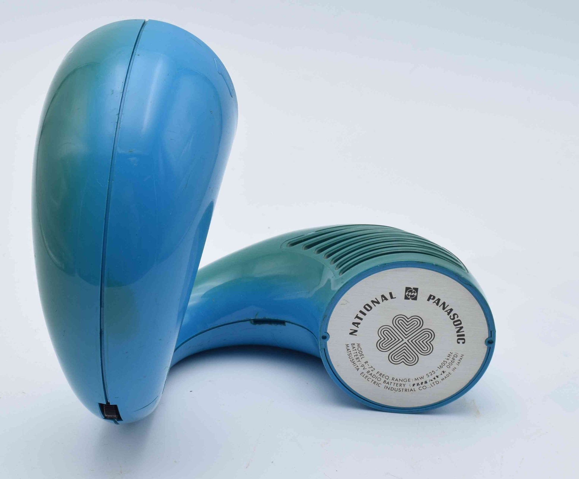 Blue handheld device with 'National Panasonic' branding on a white background